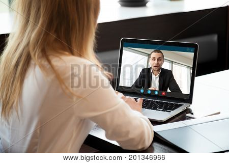 Businesswoman making video call to business partner using laptop, looking at screen with virtual web chat, contacting client by conference, talking on webcam, online consultation, hr concept, close up