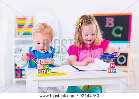 Kids At Preschool Painting