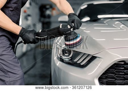 Car Detailing And Polishing Concept. Hands Of Professional Car Service Male Worker, With Orbital Pol