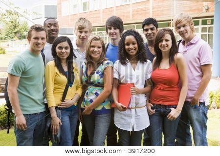 Group Of Students Outdoors Looking At Camera Smiling