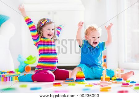 Children Playing With Wooden Toys