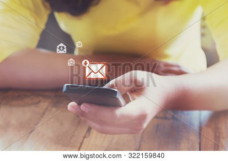 Hand Of Frmale Using Mobile Phone To Open New E-mail Message Inbox With Email Symbol And Envelope Ic