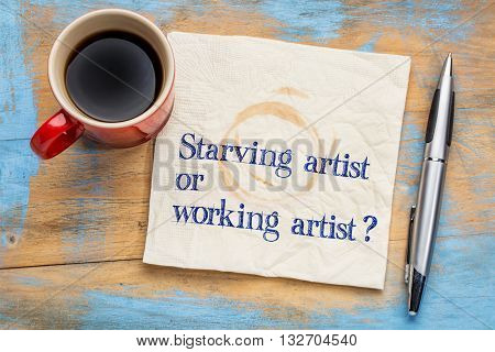 starving or working artist question - handwriting   on a napkin with a cup of coffee