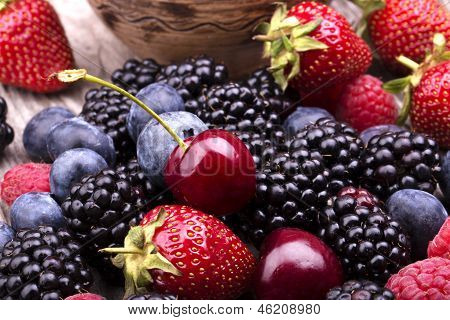 Tasty Summer Fruits On A Wooden Table