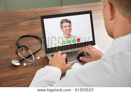 Doctor Talking To Patient Through Video Chat