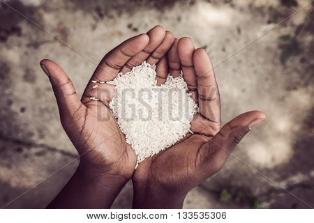 Hands holding rice