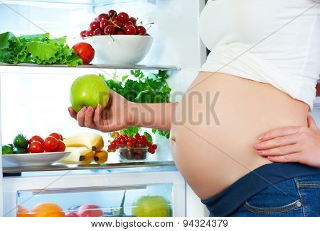 Nutrition And Diet During Pregnancy. Pregnant Woman With Fruits And Vegetables