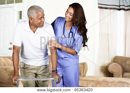 Health care worker helping an elderly man 