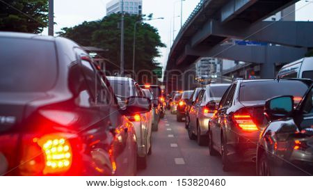 transportation vehicle and traffic concept - Blurred traffic jam and brake light in evening