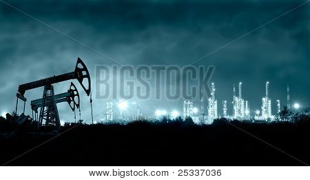 Pump Jack And Grangemouth Refinery At Night.