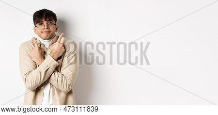 Confused Funny Guy In Glasses Pointing Fingers Aside, Showing Two Variants And Look Indecisive, Cant