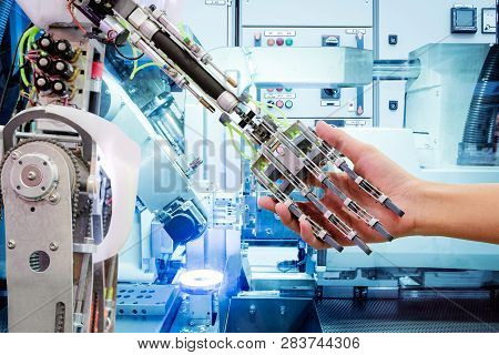 Artificial Intelligence Handshake With Humans On Industrial Robotics In Blue Tone Color Background, 