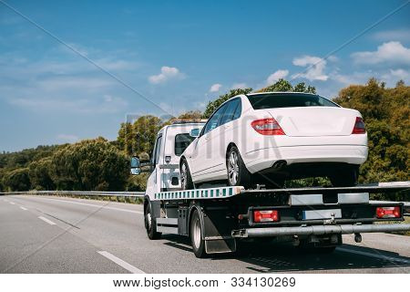 Car Service Transportation Concept. Tow Truck Transporting Car Or Help On Road Transports Wrecker Br