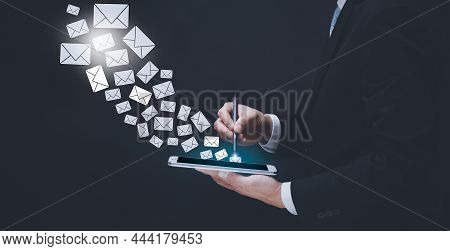 E-mail And Marketing Concept. Double Exposure Businessman Hand Hold Pen Touch Email Pressing For Sen