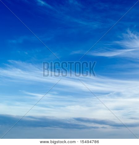 The blue sky and beautiful white clouds.