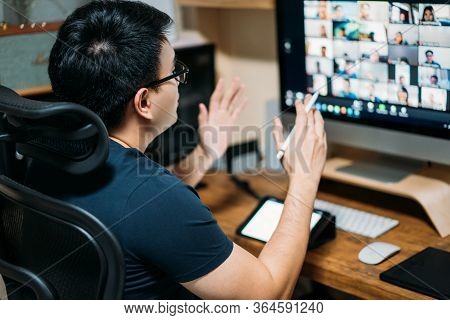 Young Asian Business Man Using Computer For A Online Business Meeting With His Colleagues About Plan