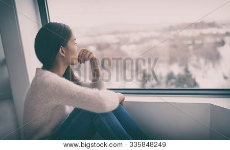 Depression, mental health, psychology therapy - mind wellness well being Asian girl with winter blues seasonal affective disorder feeling sad or heart broken with breakup alone. Loneliness, burnout