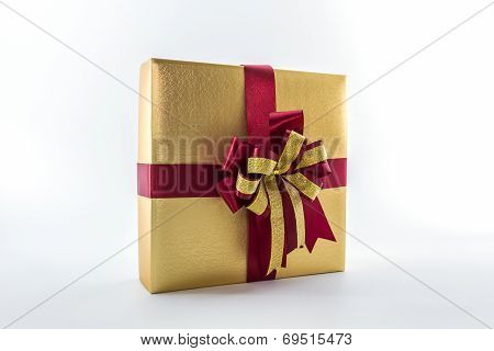 Gold And Brown Gift Box With Ribbon Bow.