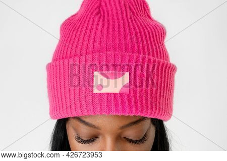 Black woman wearing a hot pink beanie mockup 