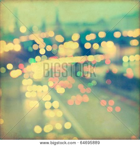 Abstract blurred cityscape background with bokeh effect. Grunge and retro style. 