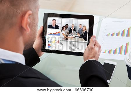 Businessman On A Video Or Conference Call On His Tablet