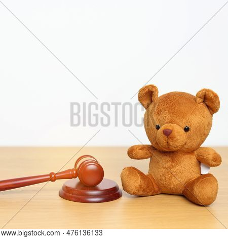 Children, Kid And Family Law Concepts. Toy Bear With Gavel Justice Hammer On Desk In Courthouse.