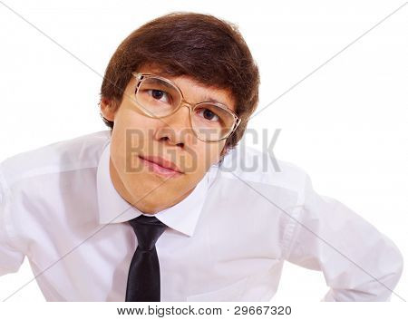 Funny geek in white shirt, tie and big freaky glasses standing and looking closeup over isolated background. Mask included