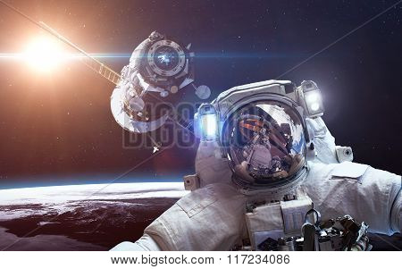 Spacecraft Soyuz orbiting the earth. Elements of this image furnished by NASA