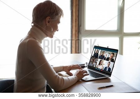 Female Employee Have Webcam Conference With Diverse Coworkers