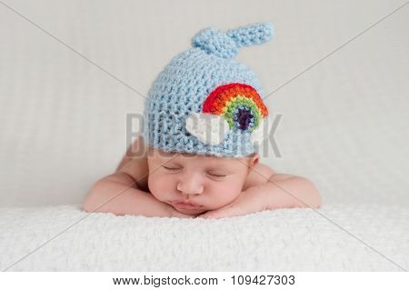 Newborn Baby Boy Wearing A Rainbow Hat