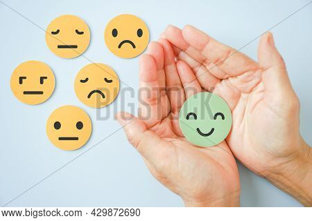 Hand Holding Happy Smile Face Paper Cut With Other On Background, Good Positive ,customer Review Fee