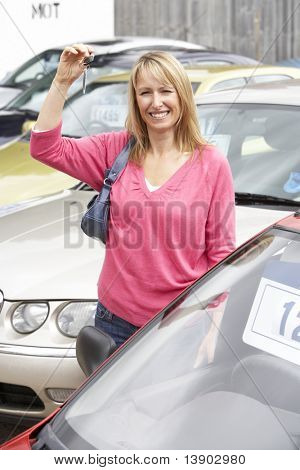 Woman collecting new car