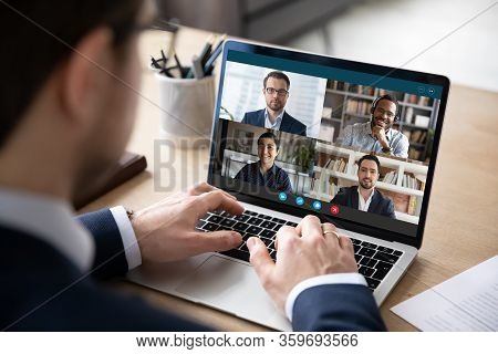 Multiracial Colleagues Engaged At Group Meeting Online Laptop Screen View