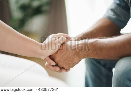 Female Friend Or Family Sitting And Hold Hands During Cheer Up To Mental Depress Man, Psychologist P