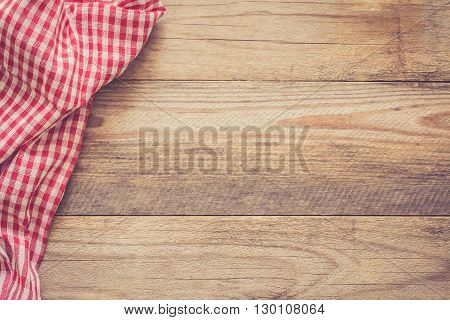 Wooden background with textile / Cooking food / pizza wooden table background with red and white textile. Copy space for text