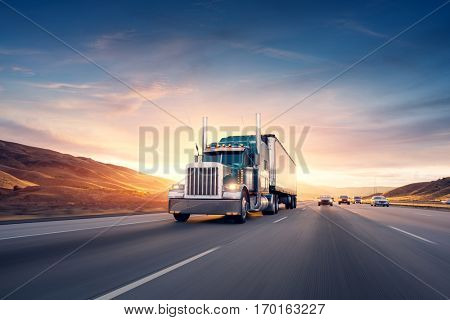 American style truck on freeway pulling load. Transportation theme. Road cars theme.