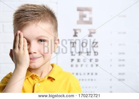 Little boy having eye test at ophthalmologist office