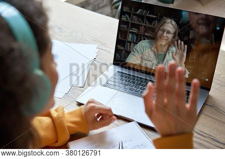 Hispanic Teen Girl School College Student Distance Learning Waving Hand Studying With Online Teacher