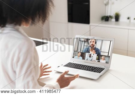 Back View Of Diverse Motivated Businesspeople Brainstorm Engaged In Team Online Webcam Meeting Brief