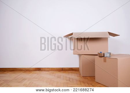 Stack Of Cardboard Boxes In The Empty Room