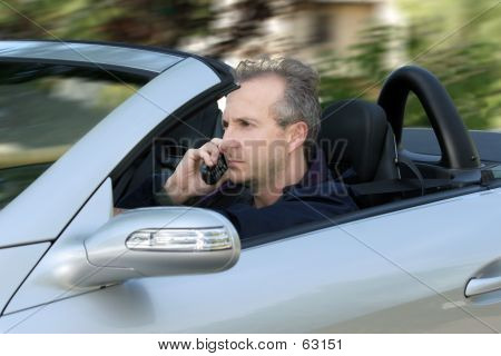 Man Driving A Car