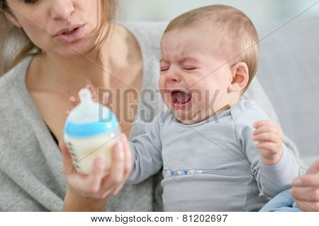 Baby boy crying to have food