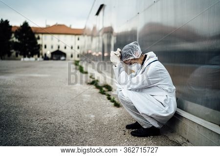 Depressed Crying Doctor With Mask Having Mental Breakdown.fear,anxiety,panic Attack Due To Coronavir