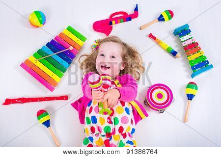 Little Girl With Music Instruments