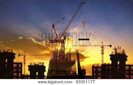 Big Crane And Building Construction Against Beautiful Dusky Sky Use For Construction Industry And En