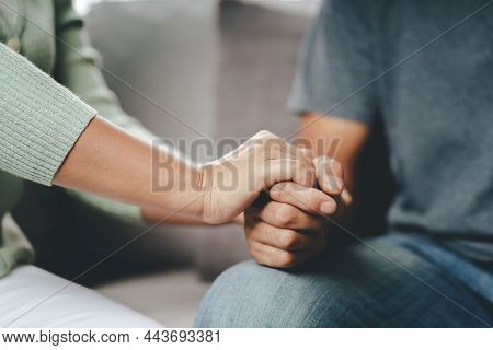 Female Friend Or Family Sitting And Hold Hands During Cheer Up To Mental Depress Man, Psychologist P