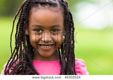 Outdoor Close Up Portrait Of A Cute Young Black Girl - African People