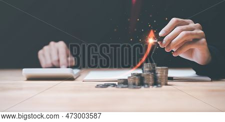 Accountant Holding A Pen ,arrow Shows Interest Rate Growth And Profitability ,investment Growth Perc