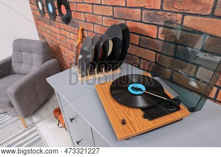 Wooden Player And Vinyl Records In Living Room