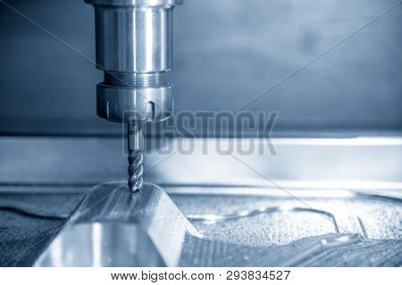 The  Cnc Milling Machine Cutting The Mould Part With The Solid Ball End Mill Tool.the Hi-technology 